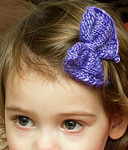knitted bow; Malabrigo Silky Merino Yarn, color 420 light hiacynth