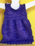 Child's knitted jumper dress; Malabrigo Silky Merino Yarn, color 30 purple mystery