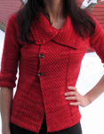Malabrigo Worsted Merino Yarn, color ravelry red #611, cardigan sweater