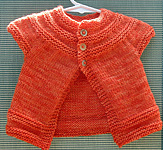 baby dress; Malabrigo Worsted Yarn, color #152 tiger lily